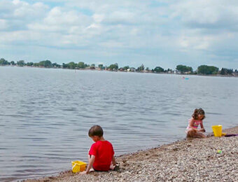children playing in the sand on a beach